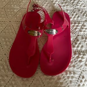Michael Kors jelly flip flops.